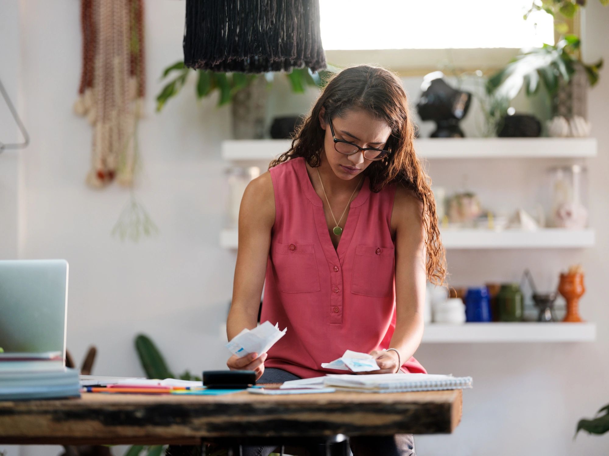 Business owner reviewing a bill and paperwork