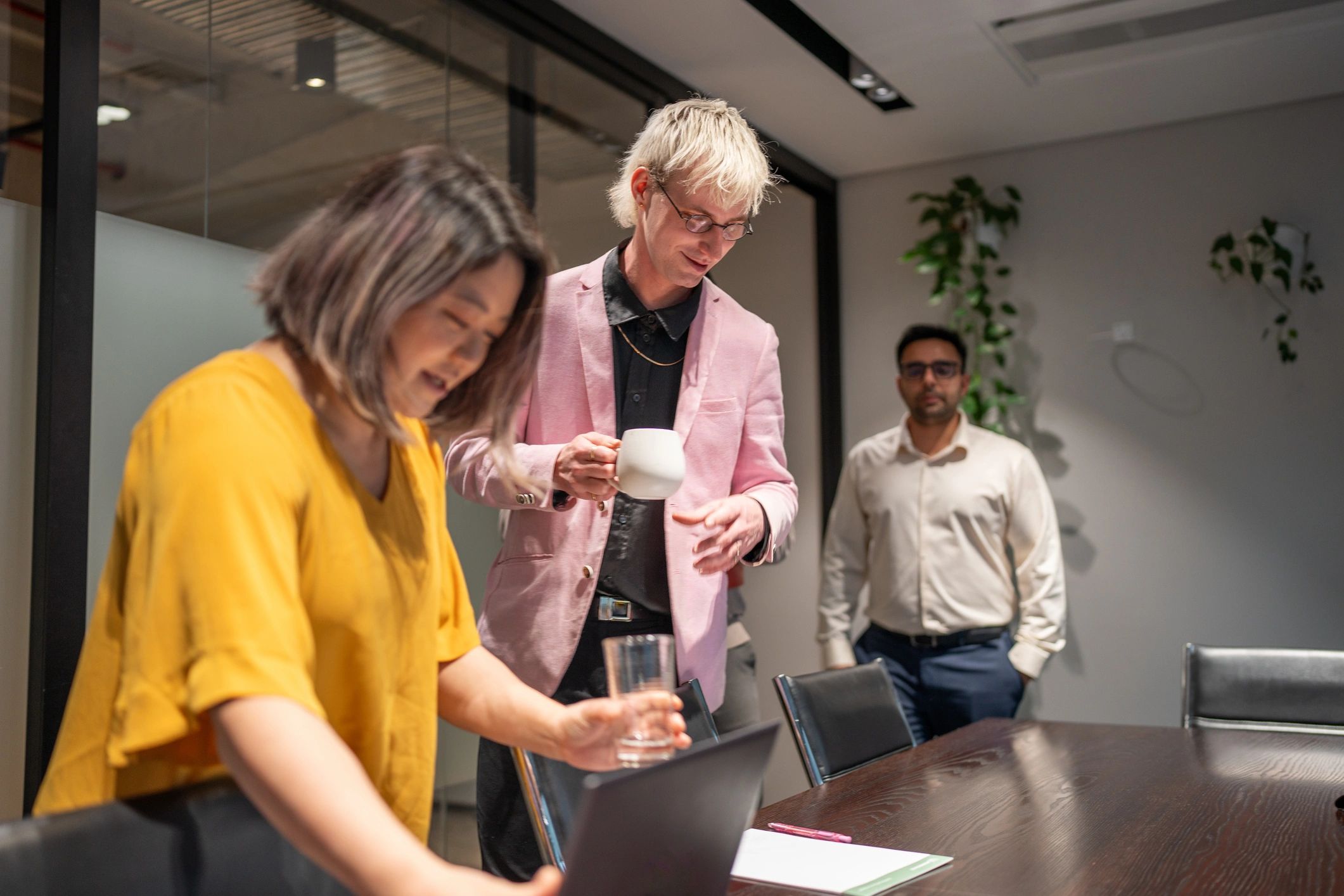 Team meeting in a modern office discussing business costs